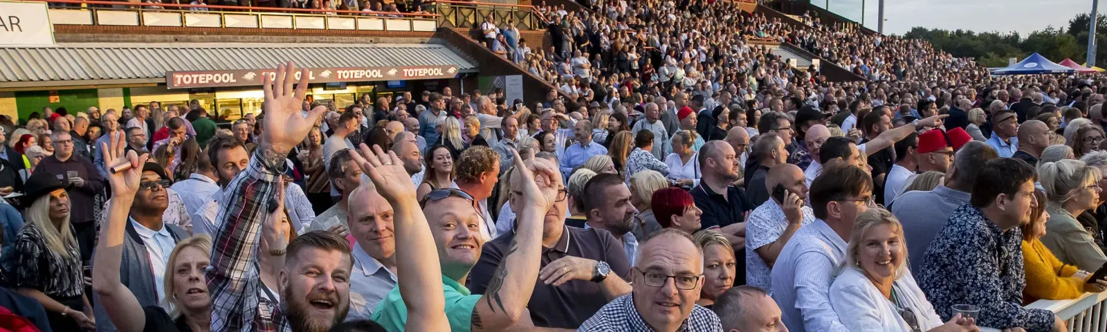 The crowd in the grandstands at Wolverhampton Racecourse