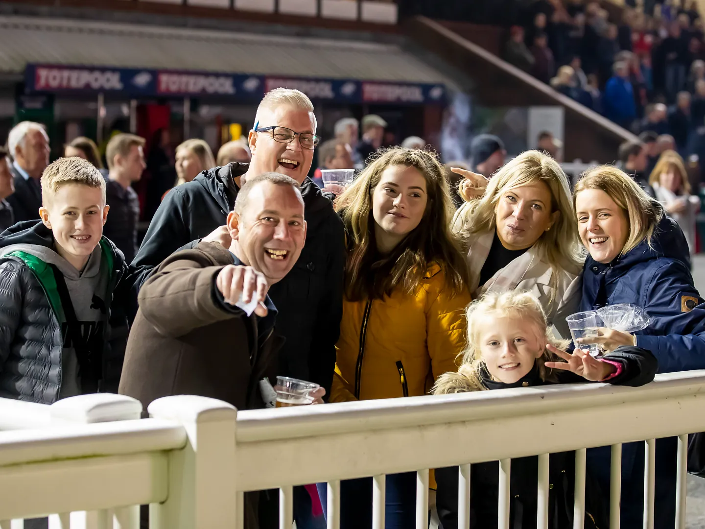 Crowd smiling at Wolverhampton Racecourse