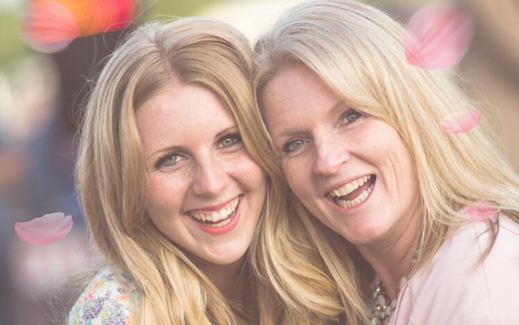 Mother and daughter enjoying the races