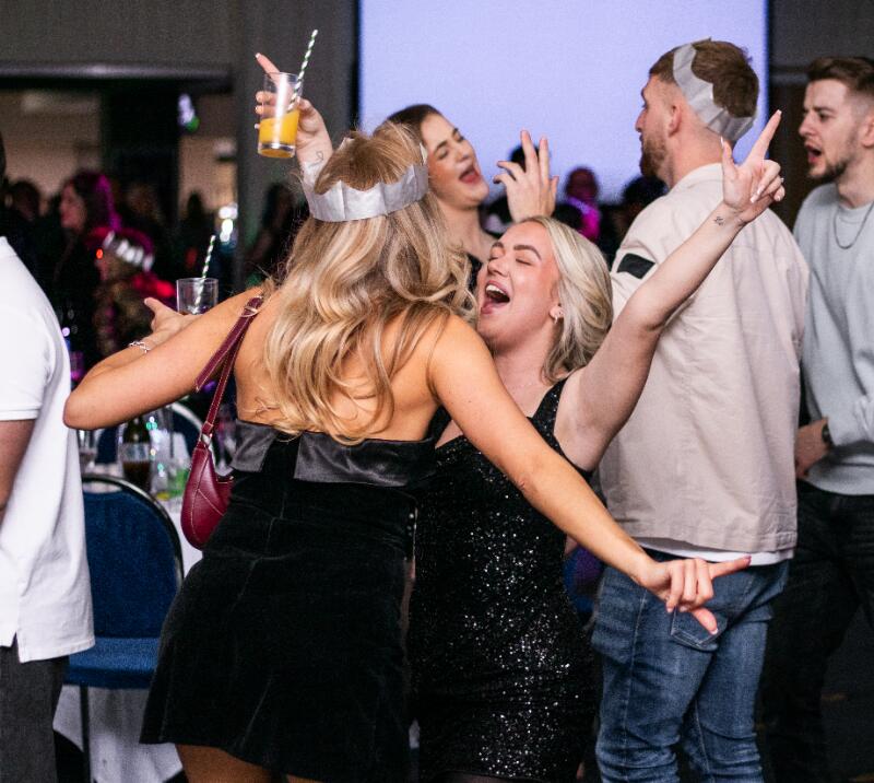 Two girls dancing at a Christmas Party at Wolverhampton Racecourse