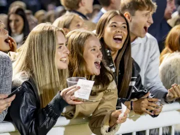 A group of young friends enjoying a race trackside at Wolverhampton Racecourse