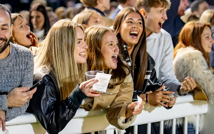 Young girls in the crowd cheering at Wolverhampton Racecourse