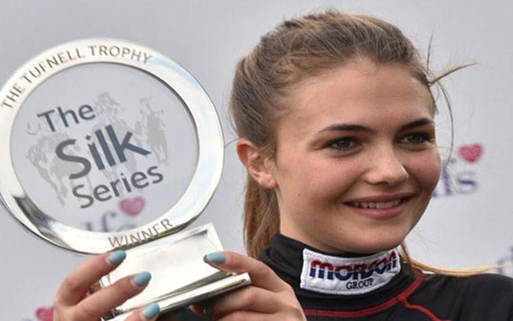 2018 winner Megan Nicholls holds Silk Series trophy