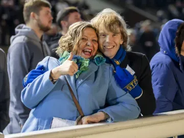 A couple happily pose at evening racing at Wolverhampton Racecourse