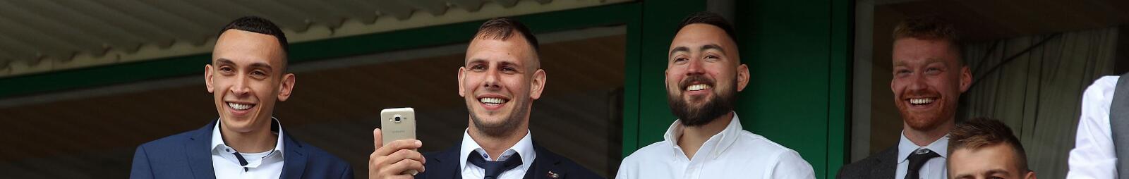 A group of smartly dressed gents enjoying hospitality at Wolves Races