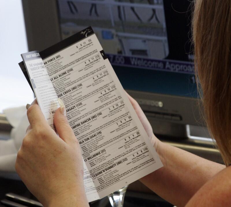 A close up of the racecard and table side screen in Wolverhampton's hospitality suite