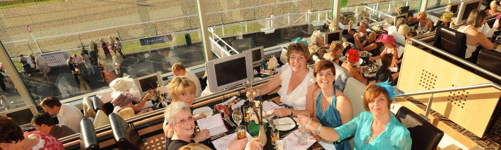 Guests enjoying a meal in Horizons Restaurant at Wolverhampton Racecourse.