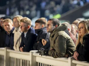 The crowd at Wolverhampton Races wrapped up for the weather watch the races