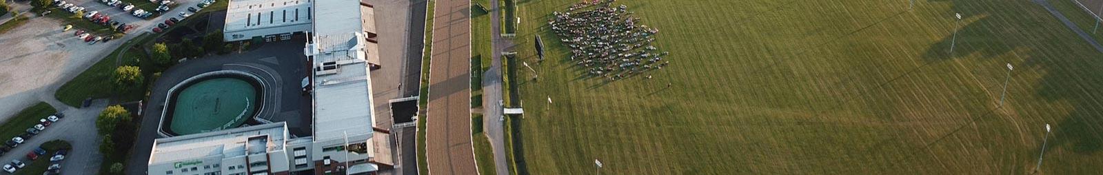 Aerial shot of the racecourse showing the grandstand and the centre course.