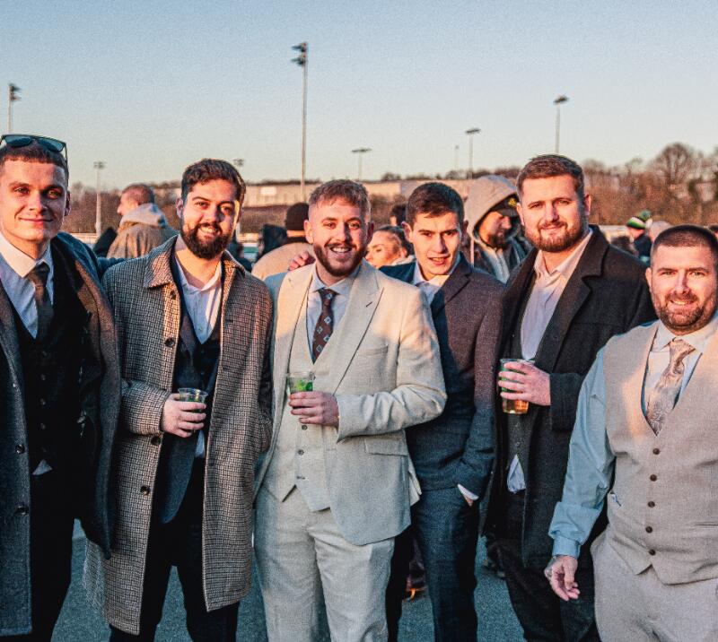 Six men dressed smart at Wolverhampton Racecourse.
