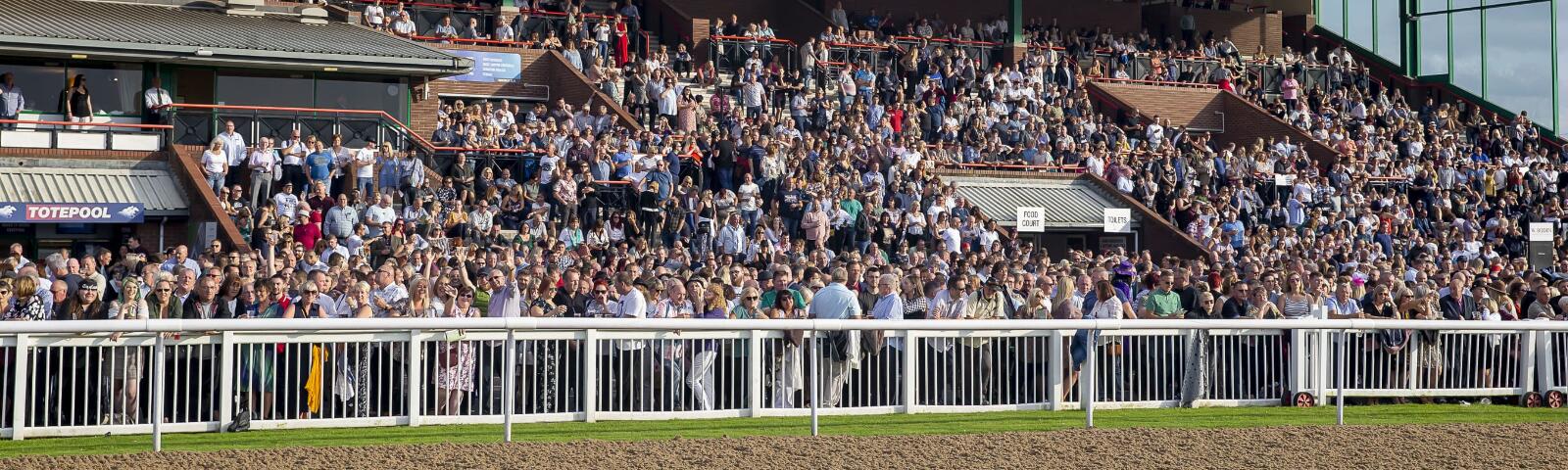 Packed grounds in the main grandstand at Wolverhampton Racecourse