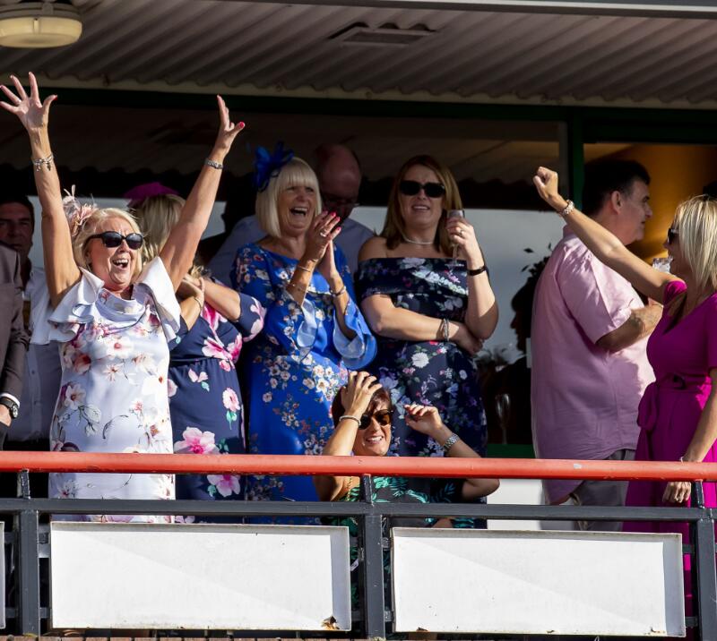 Wolverhampton Racecourse hospitality guests celebrating a win