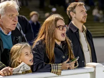 A racegoer in shock at the race unfolding at Wolverhampton Racecourse