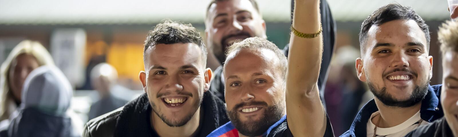 A group of guys enjoying the atmosphere at Wolverhampton Races